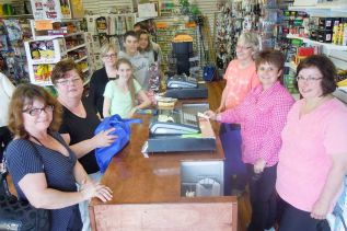 at left (back to front) Cindy Warren and Holly Davis served patrons at the grand opening of The Amazing Dollar Store in Sharbot Lake on May 16